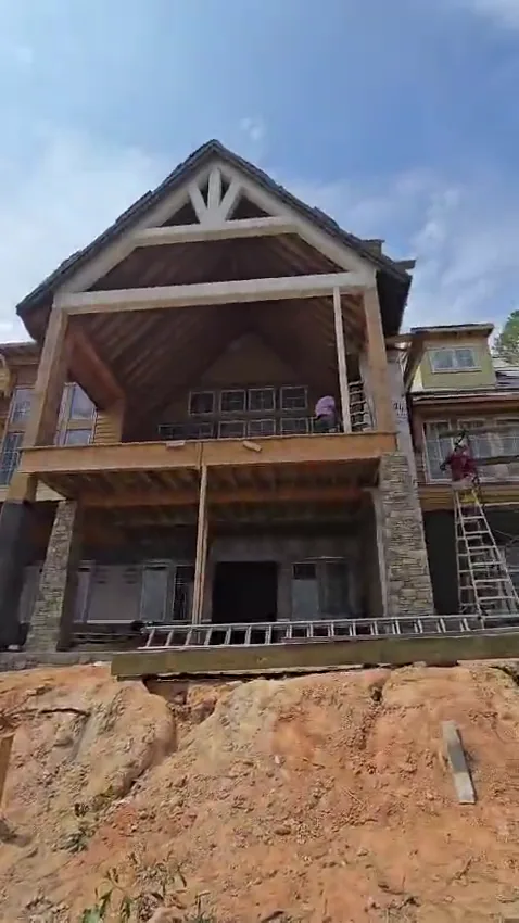 SQ Painting crew working on a home exterior